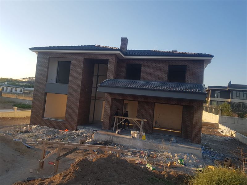 Gölbaşı Hacıhasan'da özel villa: tuğla cephe